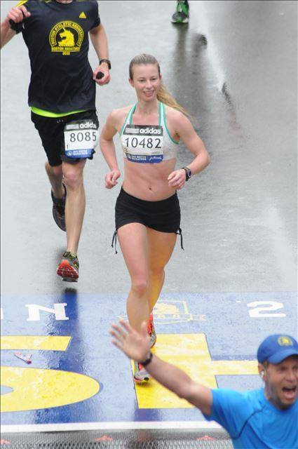 Crossing the Boston Marathon finish line in 2015